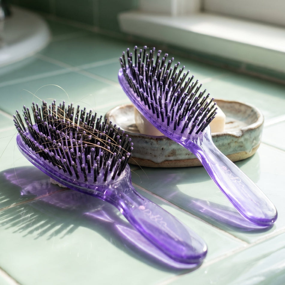 Meet the Duboa Lilac Brush Duo — a Large 80 and Medium 60 pairing crafted in Japan for hair that deserves professional-grade care every single day. Whether you're working through thick, coarse strands or maintaining a fine blowout, these brushes glide through knots with zero snagging.