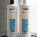Nioxin System 3 Cleansing Shampoo snd Scalp Revitaliser Conditioner — 1000ml Duo

Give chemically treated, fine or thinning hair the professional-grade care it deserves. The Nioxin System 3 1000ml Duo pairs two salon-favourite formulas into one powerful regime — designed to amplify volume, restore moisture balance, and deliver noticeably thicker, fuller-looking hair with every wash.