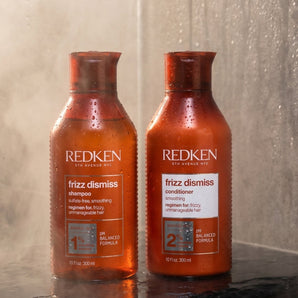 Redken Frizz Dismiss Shampoo &amp; Conditioner Duo is a professional anti-frizz system powered by Redken's Smoothing Complex with Babassu Oil — delivering humidity protection, silky smoothness, and brilliant shine from wash to finish.