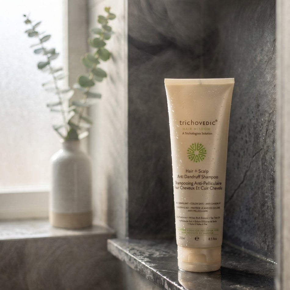 Trichovedic Hair+Scalp Anti-Dandruff Shampoo, a hypoallergenic, sulfate-free formula specifically designed for KST aftercare and dandruff control. This gentle yet effective shampoo combines zinc pyrithione and willow bark extract with nourishing botanicals including tea tree oil, sage, nettle, and peppermint oil to eliminate dandruff, soothe sensitive scalps, and leave hair healthy and revitalized.
