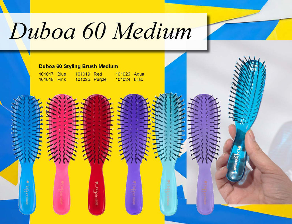 Set of Duboa 60 Medium hairbrushes in various colors with a hand holding a blue brush.